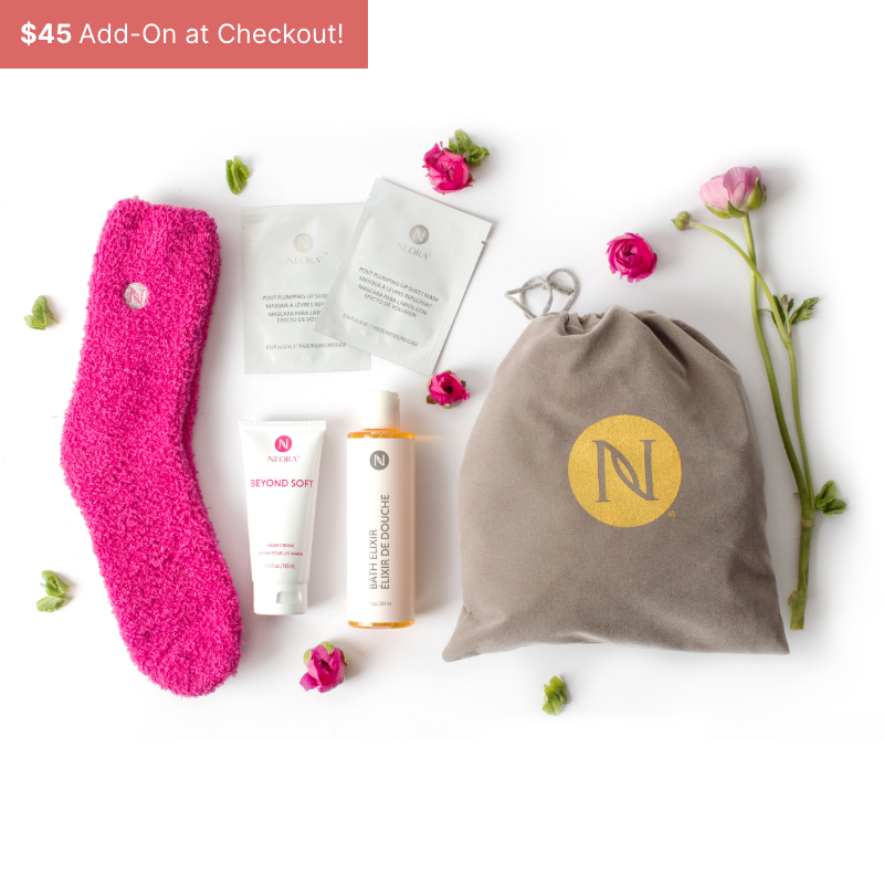 Neora Mother’s Day special Luxe Self Care gift set including fuzzy socks, lip sheet masks, hand lotion, bath elixir and a velvet drawstring gift bag in which to present it.